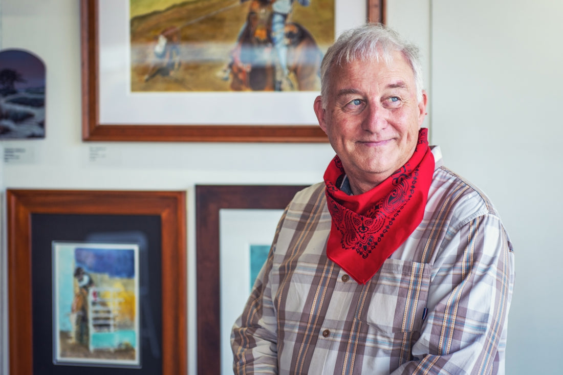 man in gray and white plaid dress shirt and red scarf