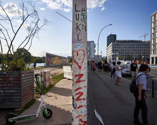 a pole that has some graffiti on it