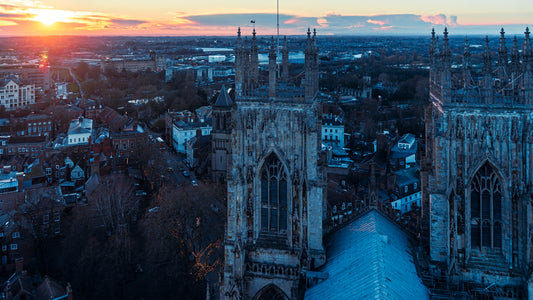 an aerial view of a city at sunset