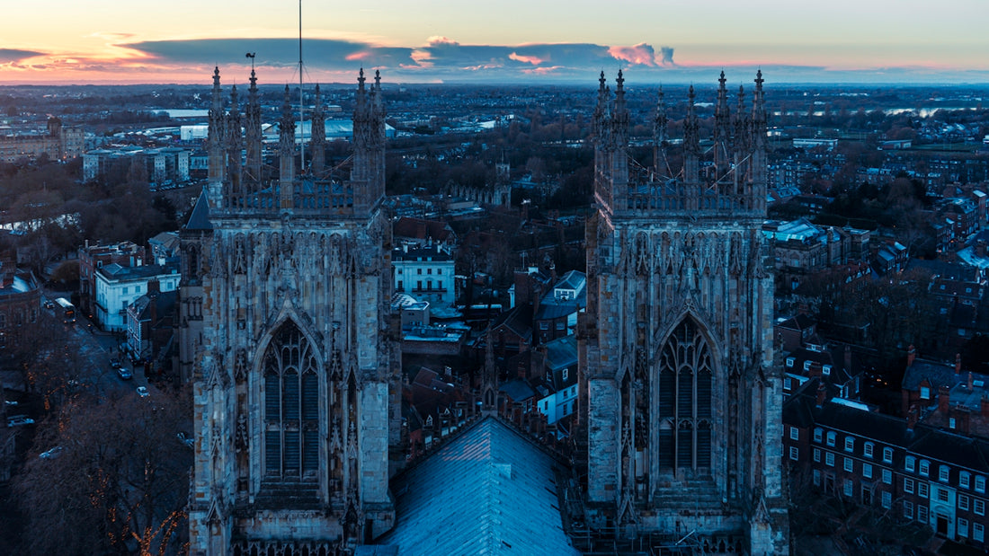 an aerial view of a city at sunset