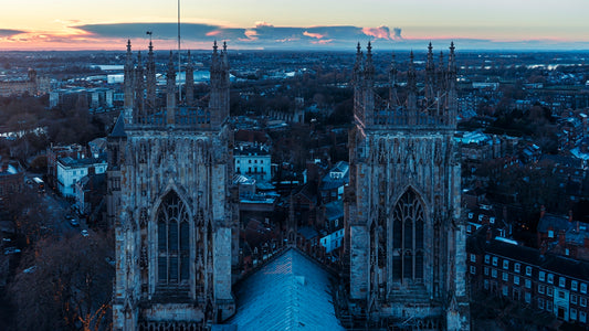 an aerial view of a city at sunset