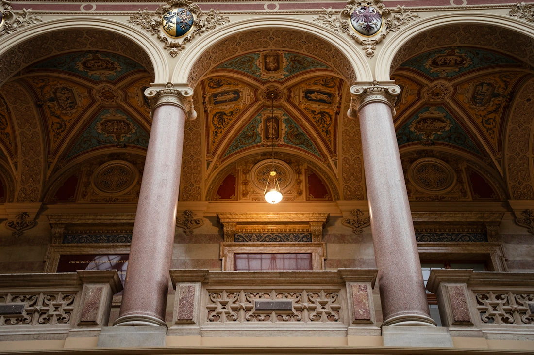 an ornate building with columns and a light