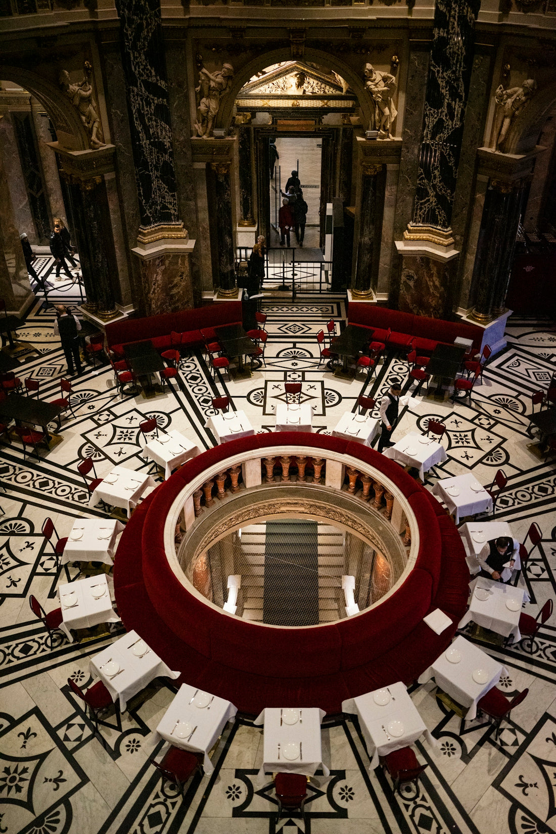 a circular room with tables and chairs in it